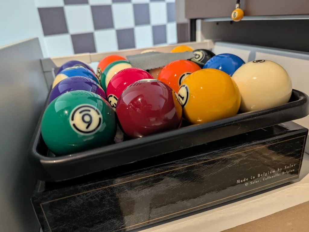 Billiard balls in tray